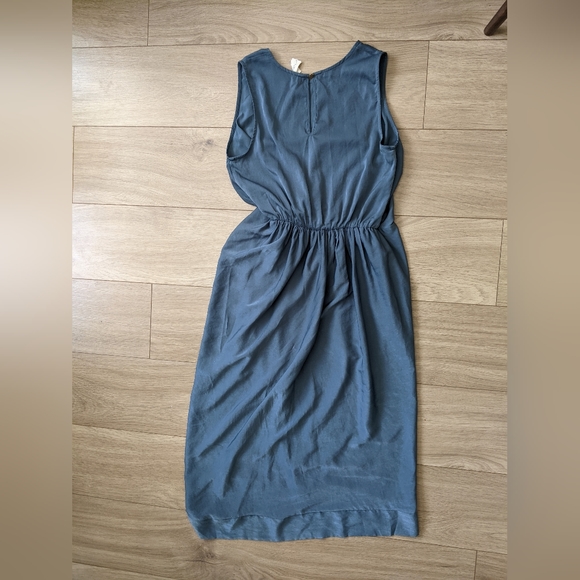 Asymmetrical, teal dress with waist cinching. - Picture 2 of 7